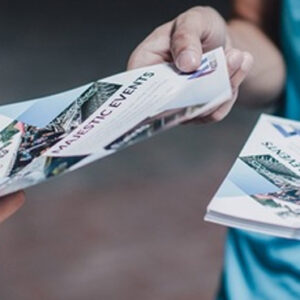The Power of Tangible Marketing: Why Homeowners Pay Attention to a Door Hanger Delivery Service